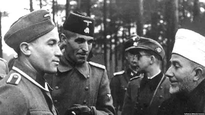 Хусеин Ђозо (1912-1982), заменик имама 13. СС Ханџар дивизије (други слева) у друштву немачког СС официра и Великог муфтије јерусалимског Мухамеда Амин ал Хусеинија Фото: Wikimedia Commons, Музеј револуције народа Југославије